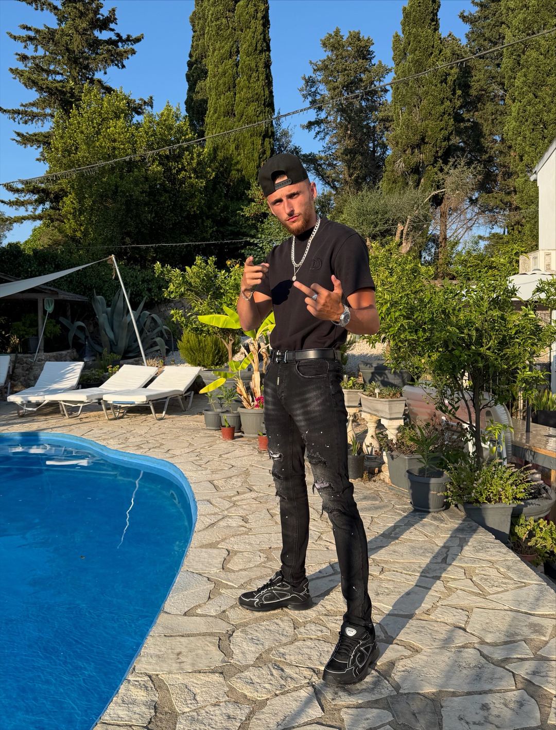Alpha Nath JS poolside in Corfu